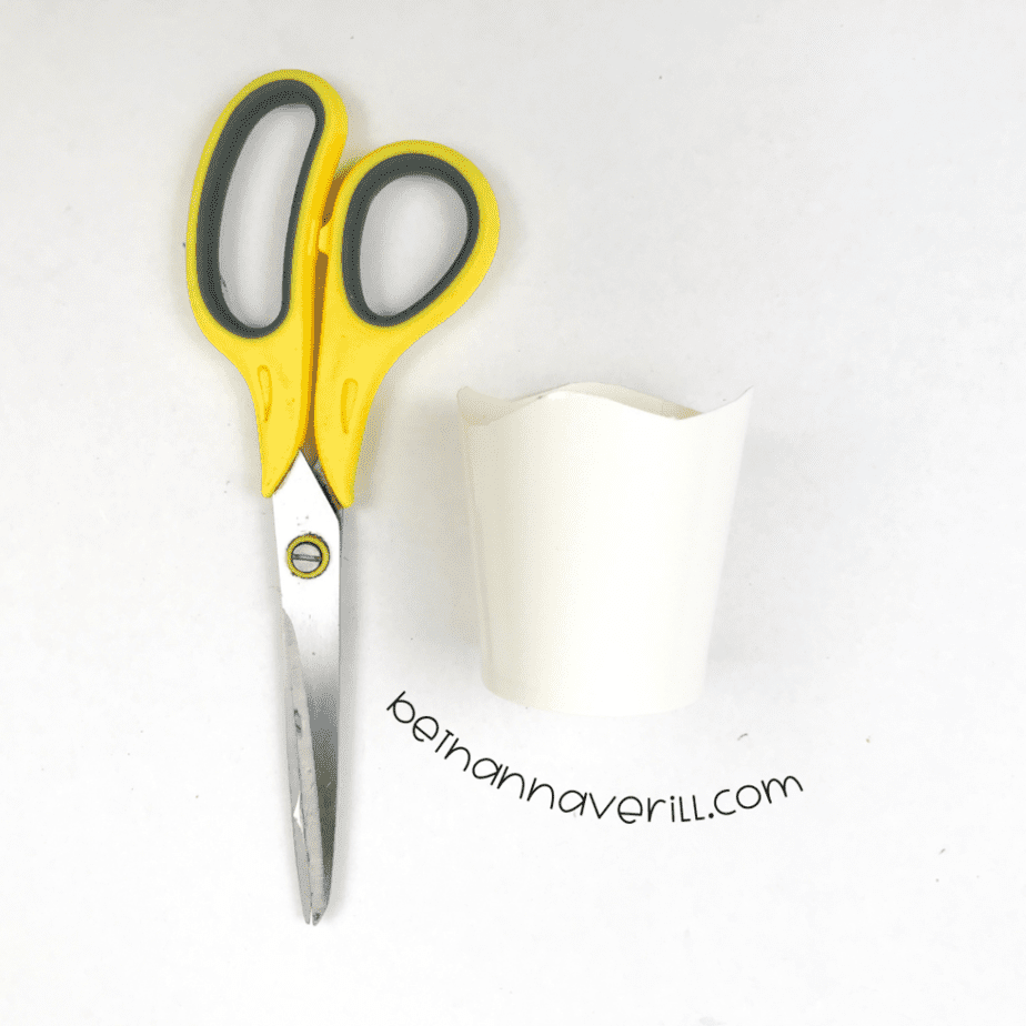 Paper cup with curves cut along the bottom