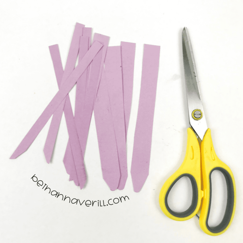 Purple paper strips cut for octopus tentacles