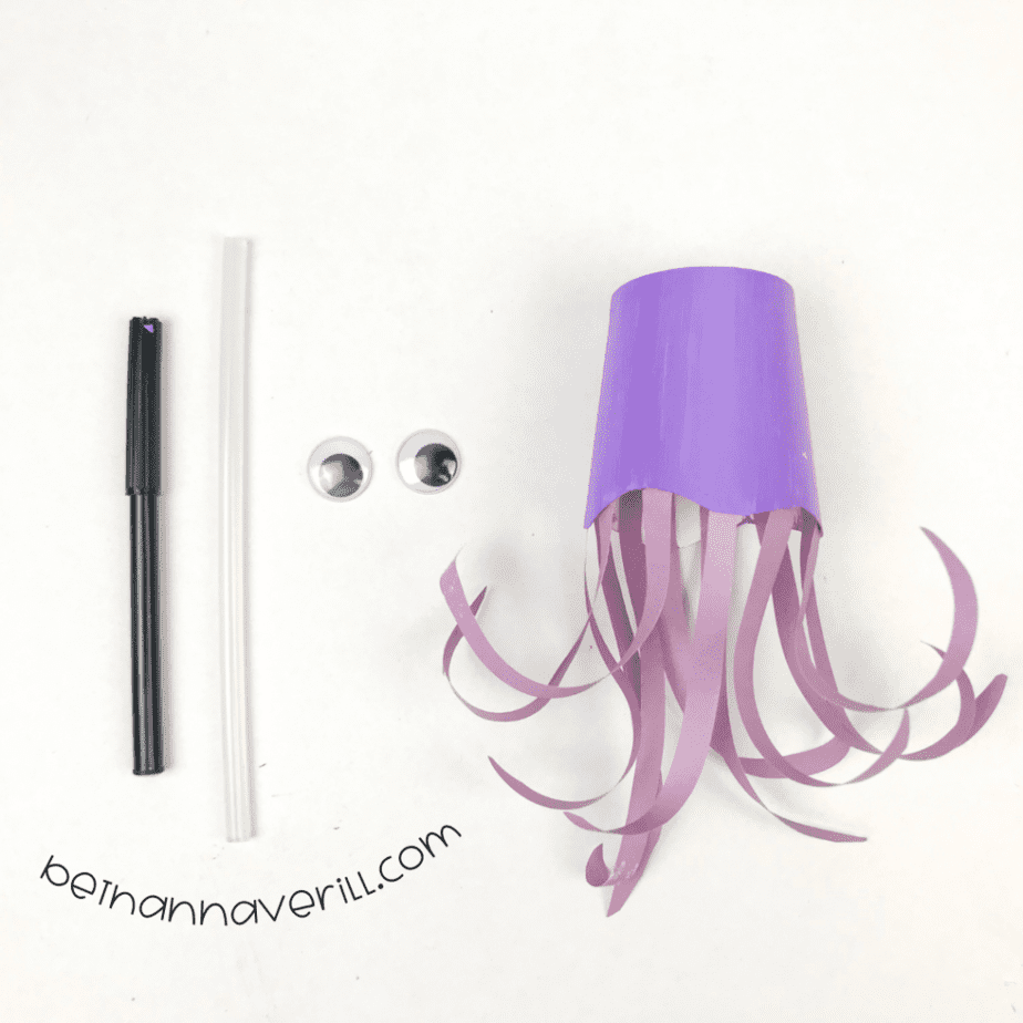 Googly eyes on the paper cup octopus