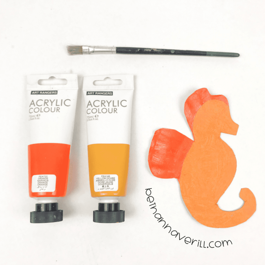 Paper plate seahorse painted orange and yellow