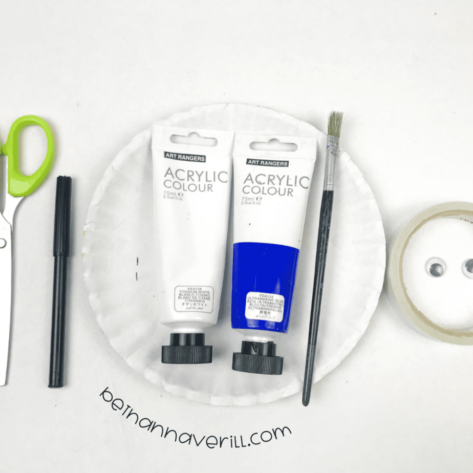 Paper plates, blue and white paint, brushes, tape and scissors