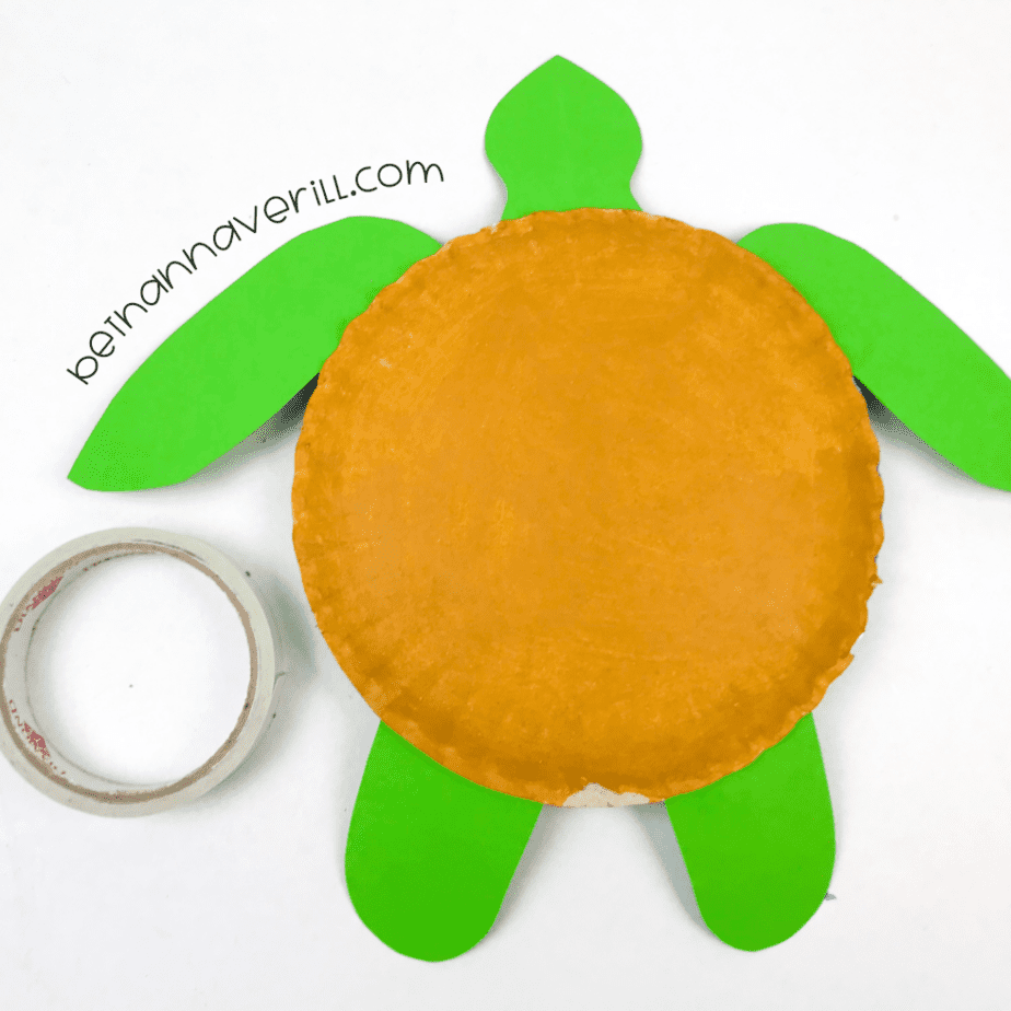 Green head and feet attached to the yellow plate