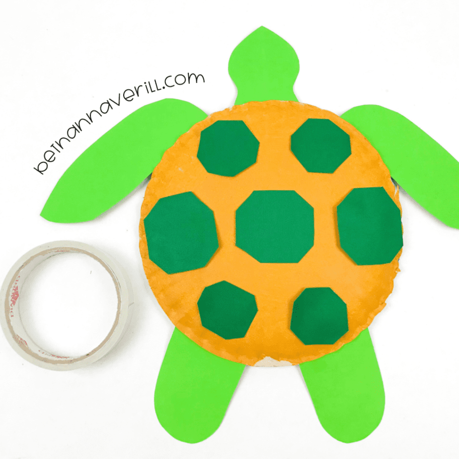 Dark green spots glued on the yellow turtle shell