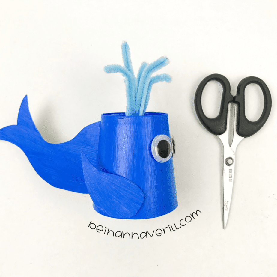 Googly eyes and a blue pipe cleaner spout on the whale cup