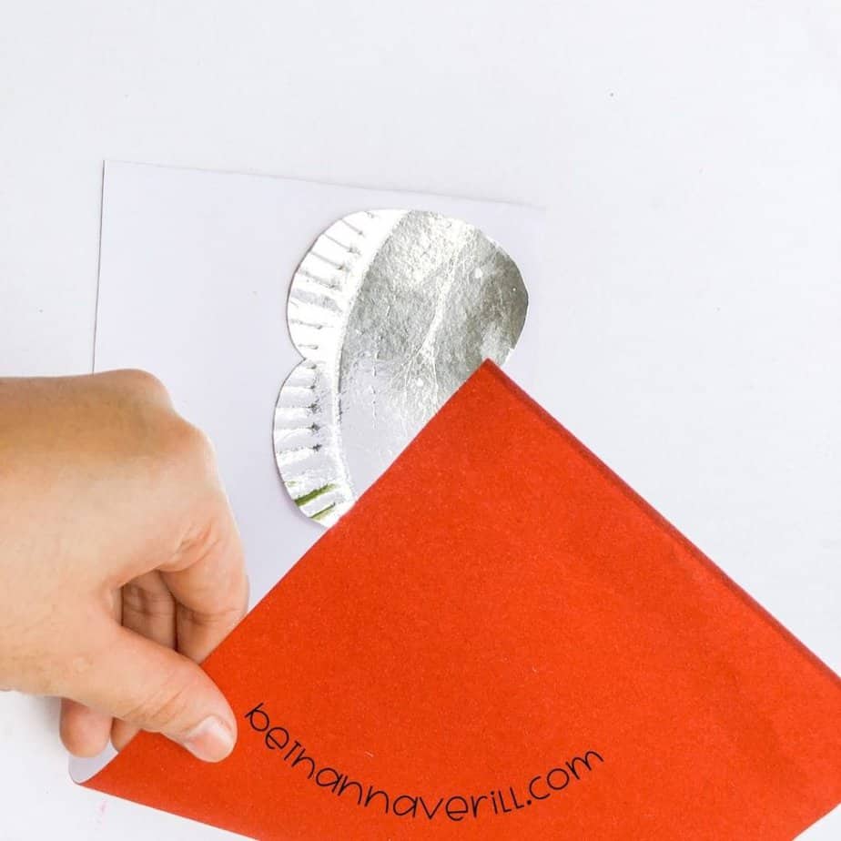 Paper plate apple pasted onto red paper