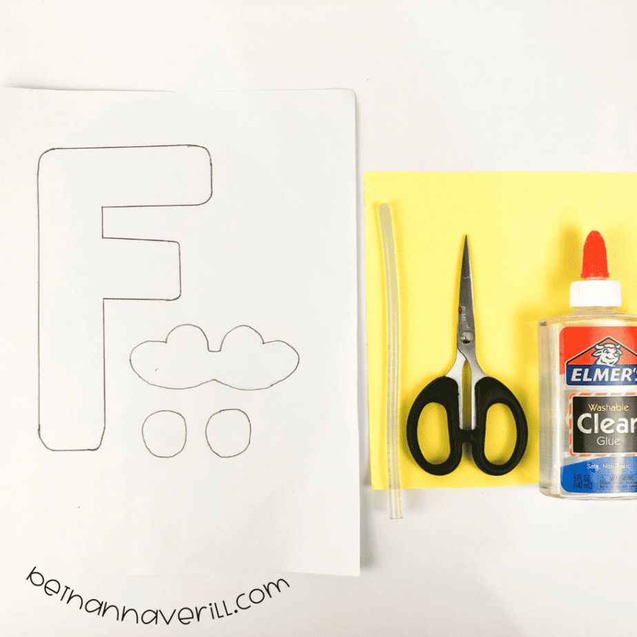 Construction paper, glue, a marker, scissors and the printable F is for Frog template