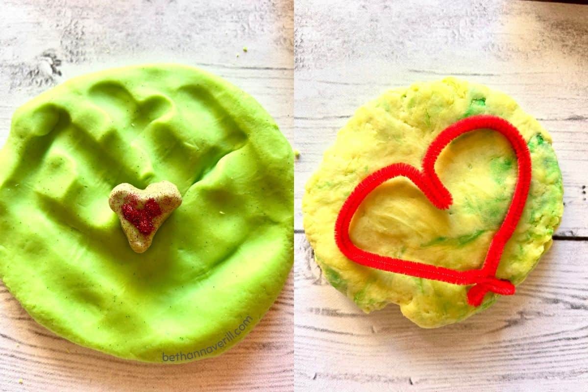 Green play dough with a glitter heart in the center