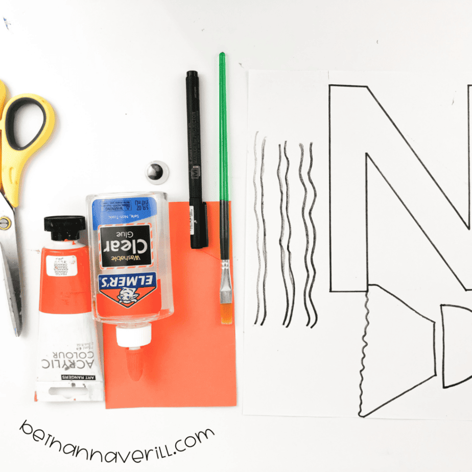 Construction paper, glue, a marker, scissors and the printable N is for Nemo template