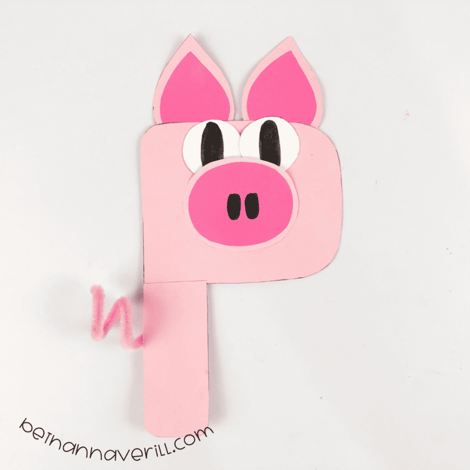 Curly pink pipe cleaner tail attached to the pig P