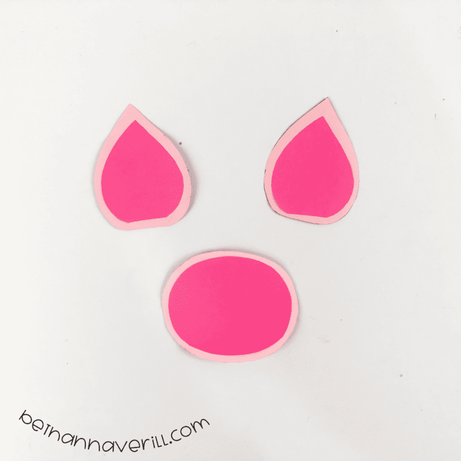 Dark pink pieces glued inside light pink ears and nose