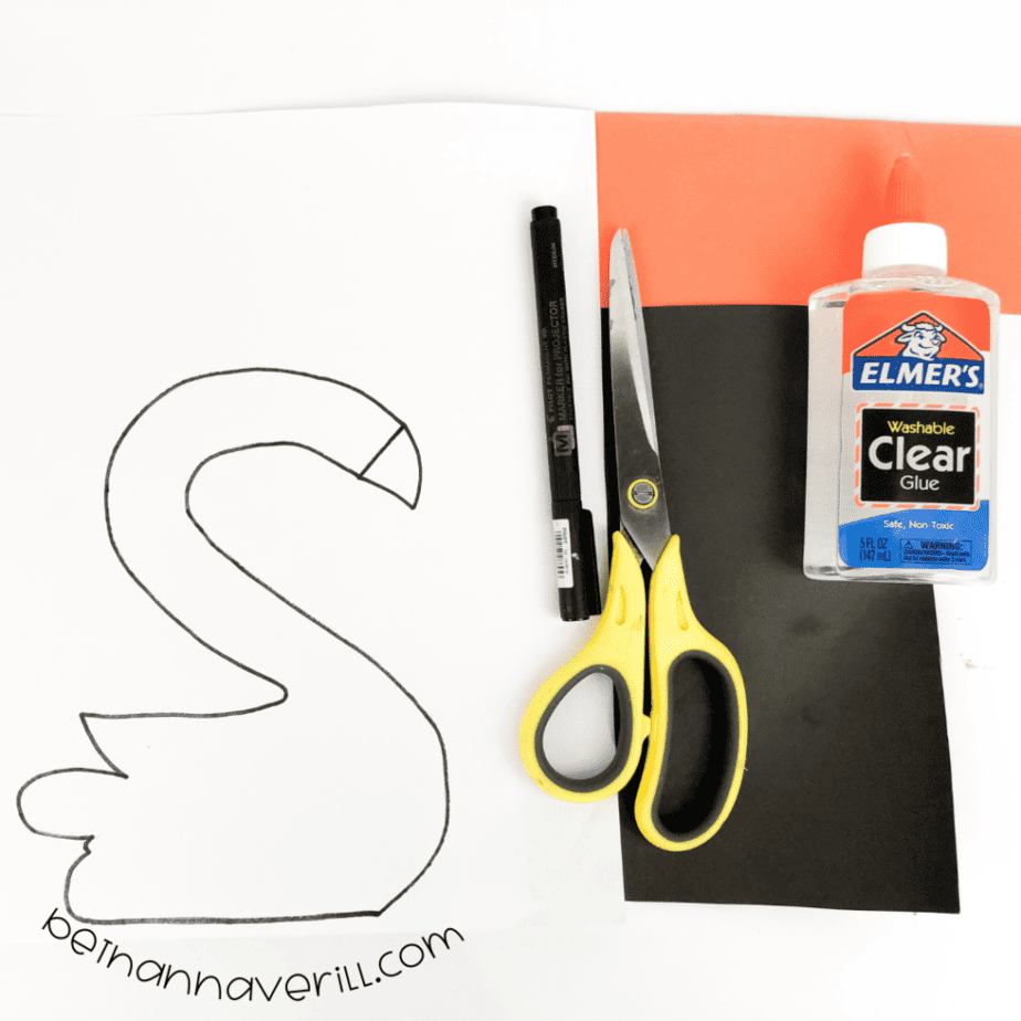 Construction paper, glue, a marker, scissors and the printable S is for Swan template