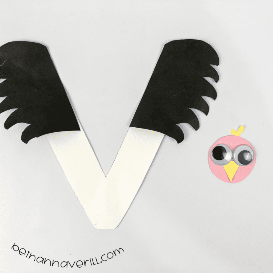 Vulture face placed at the center of the V