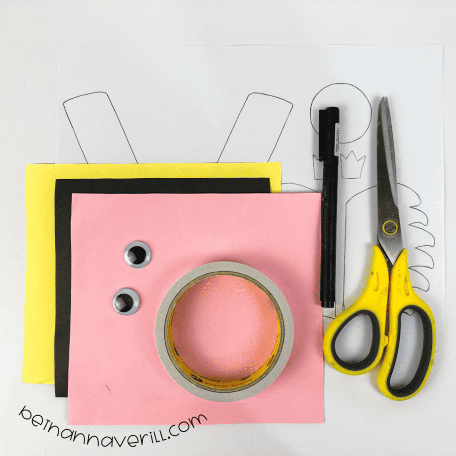 Construction paper, glue, a marker, scissors and the printable V is for Vulture template
