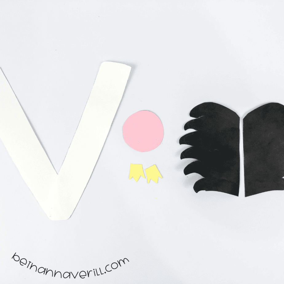 White V, pink face and black wing pieces cut out