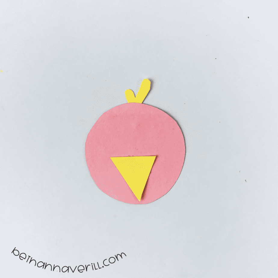 Yellow beak and tuft glued onto the pink circle face