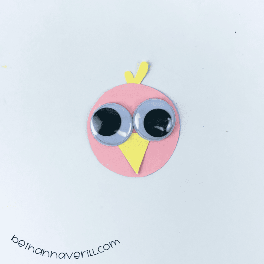Googly eyes on the pink vulture face