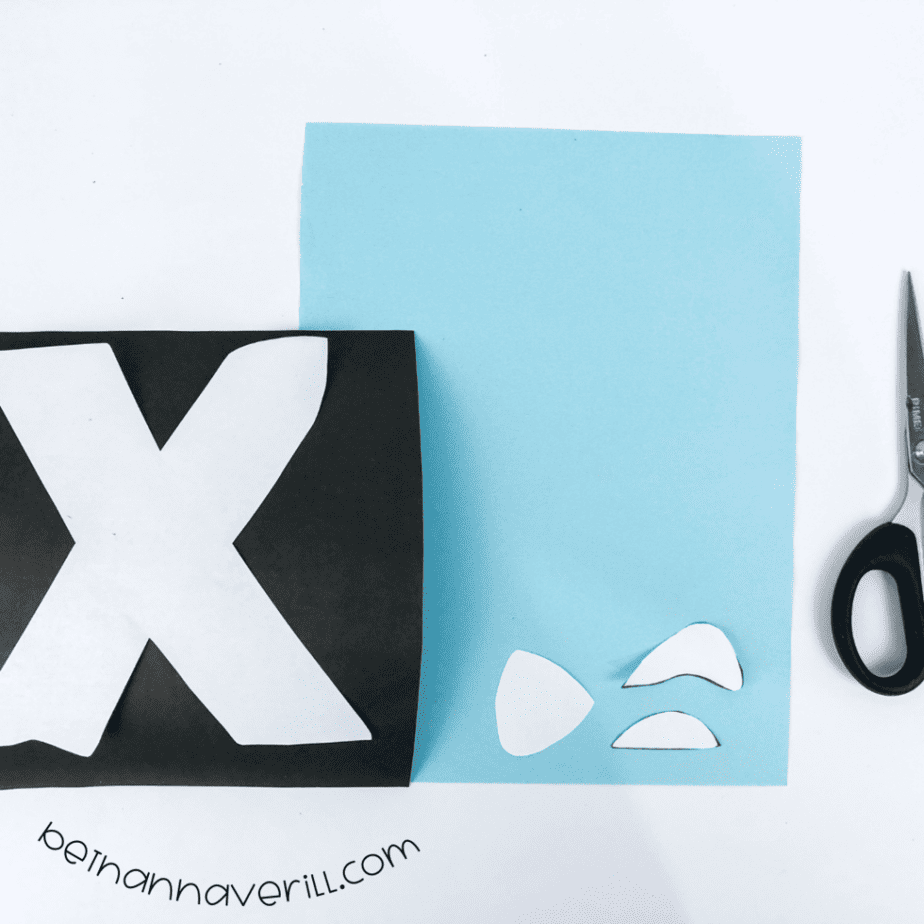 Black X and blue fish pieces traced and cut