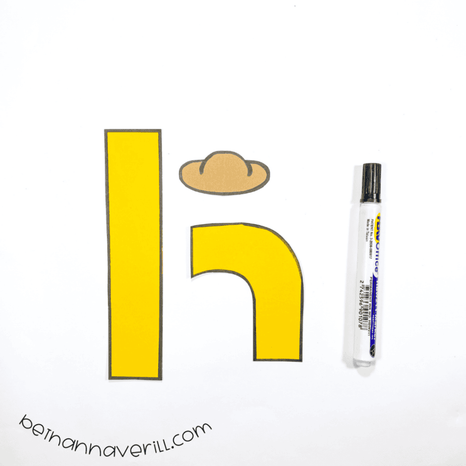 Black marker outlines around the h is for Hat paper shapes