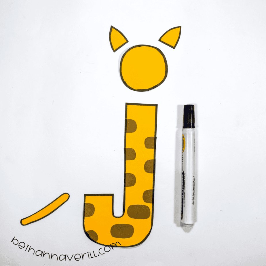 Black marker outlines around the j is for Jaguar paper shapes