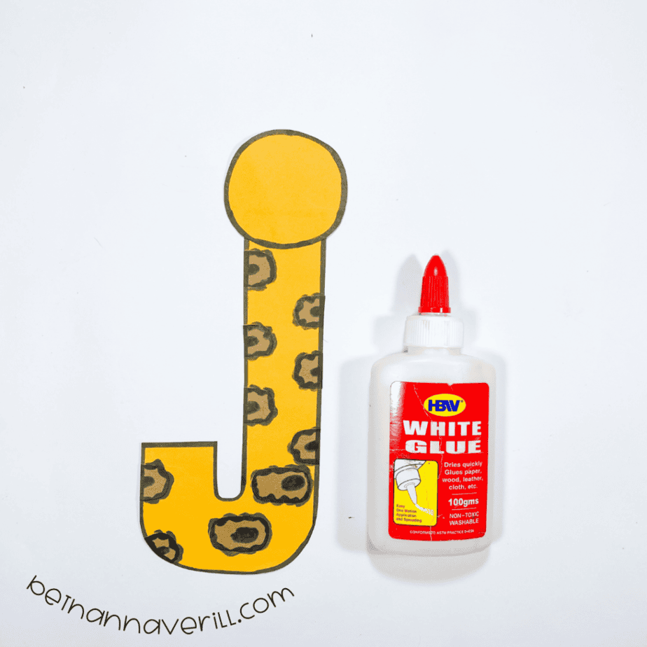 Dot glued above the jaguar body to form the letter j