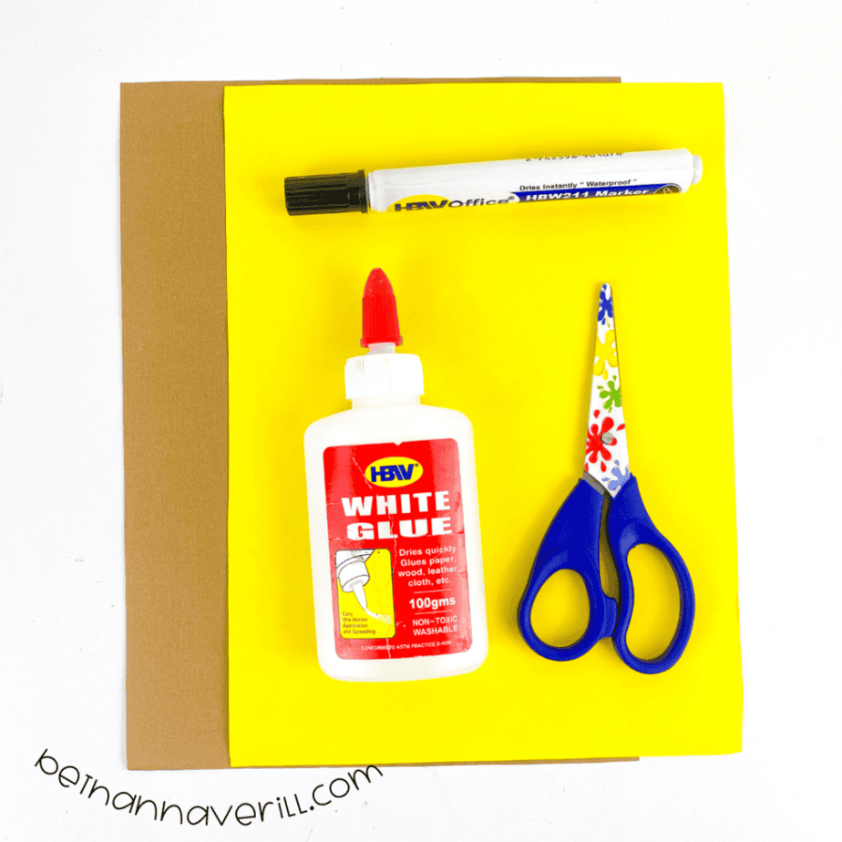 Construction paper, glue, a marker, scissors and the printable l is for Lamp template