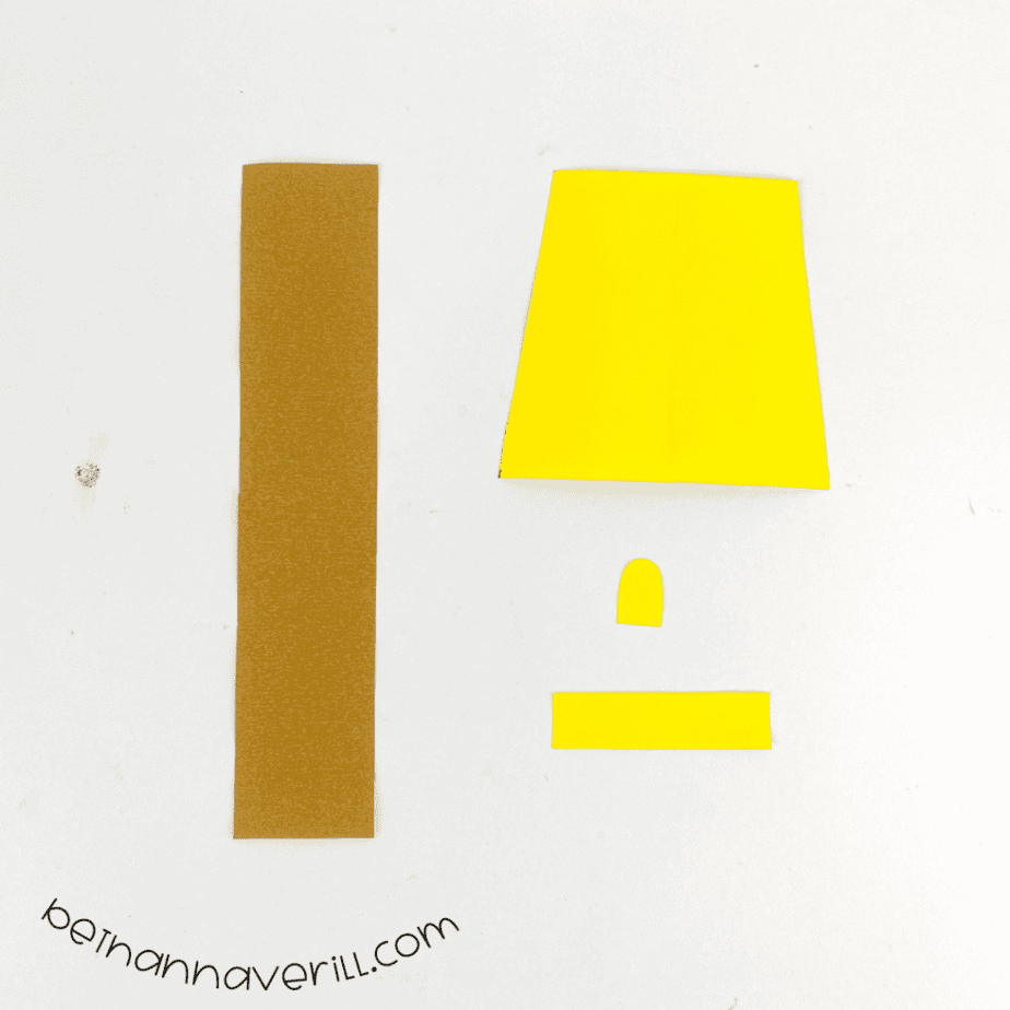 Brown rectangle and yellow lamp pieces cut from construction paper