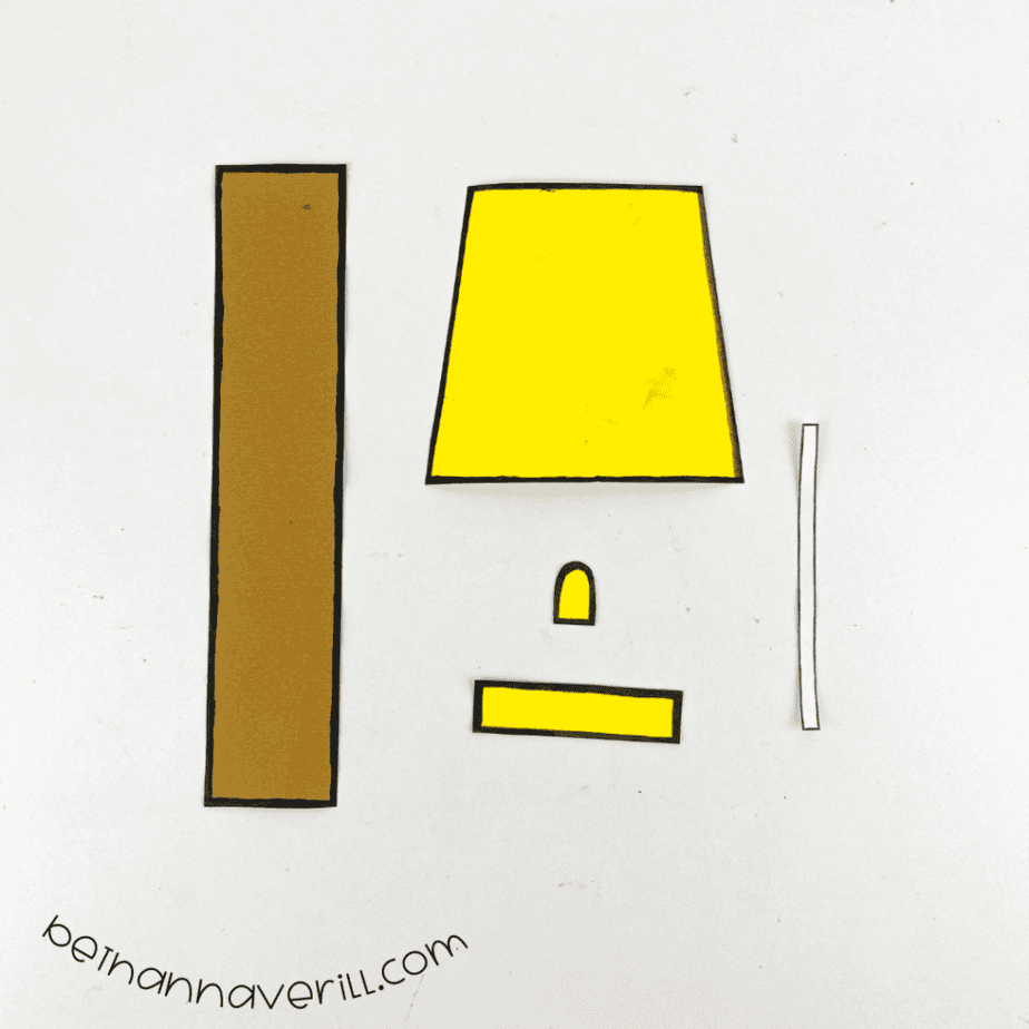 Black marker outlines around the l is for Lamp paper shapes
