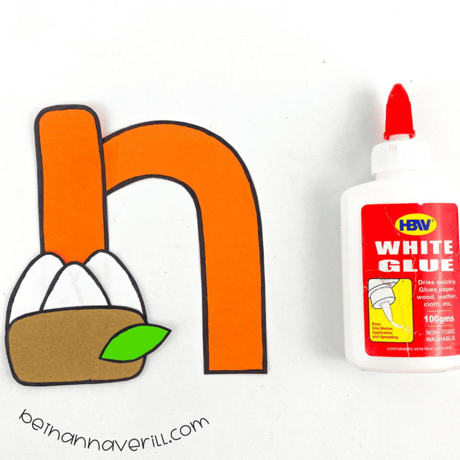 Paper nest glued onto the orange lowercase n