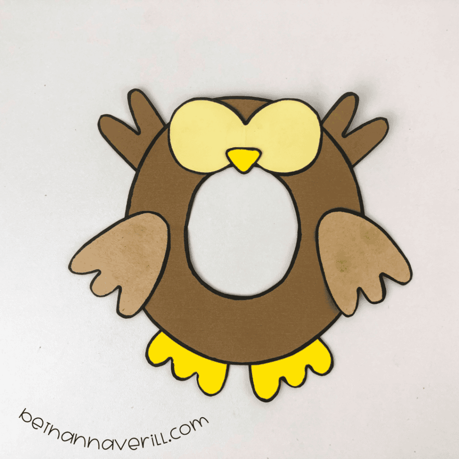 Feathers glued behind the o and wings on the front