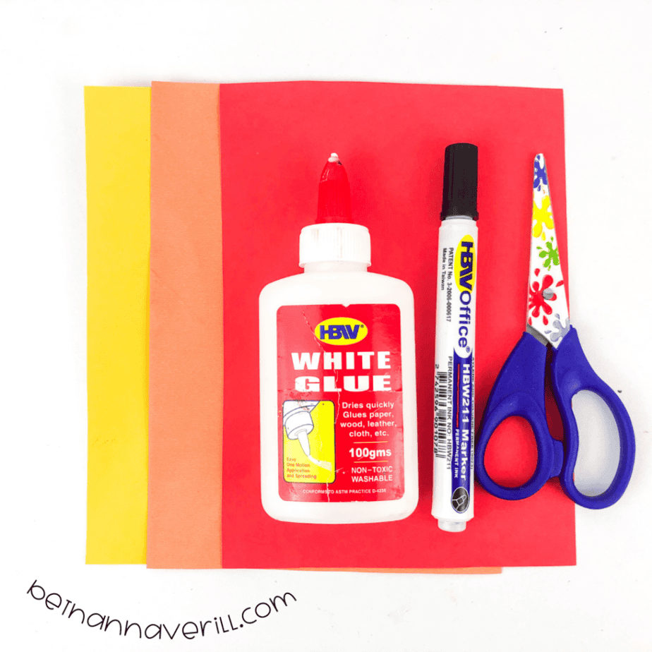 Construction paper, glue, a marker, scissors and the printable p is for Planet template