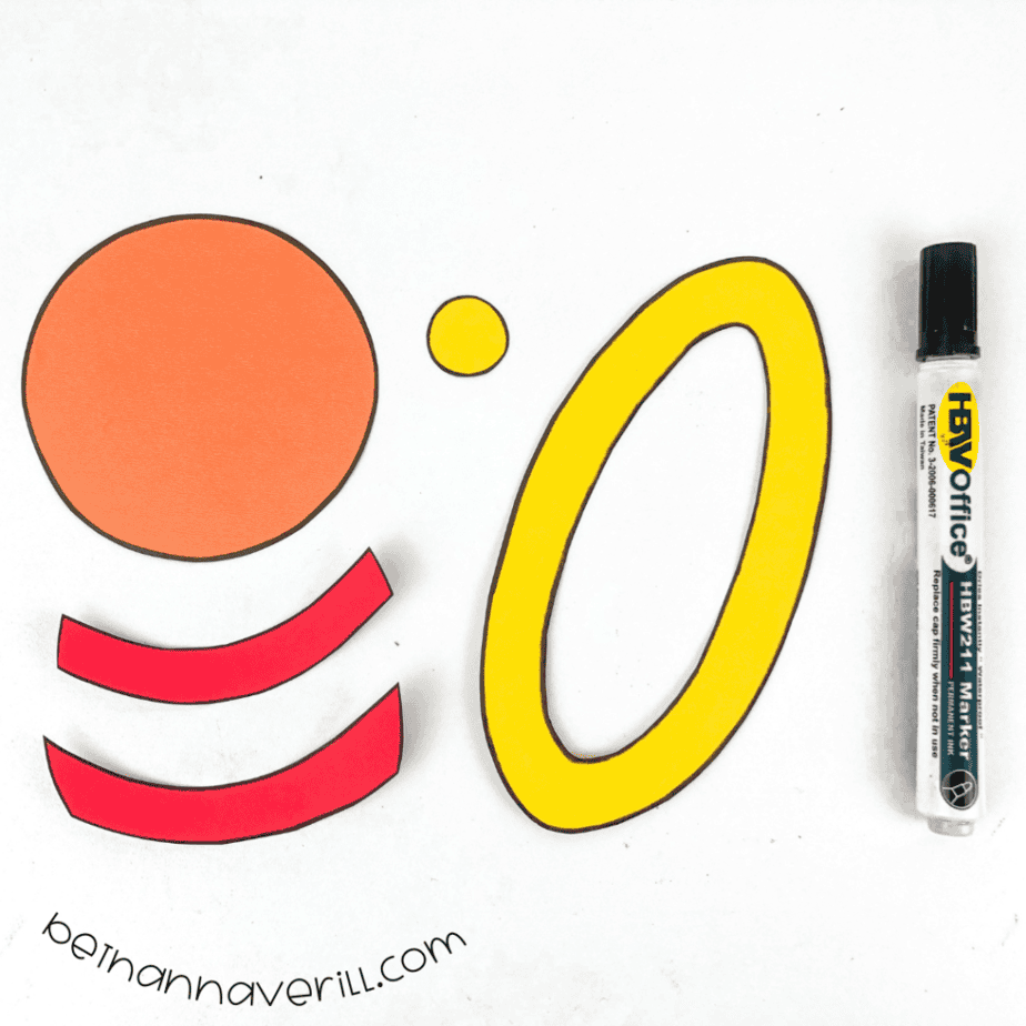 Black marker outlines around the p is for Planet paper shapes