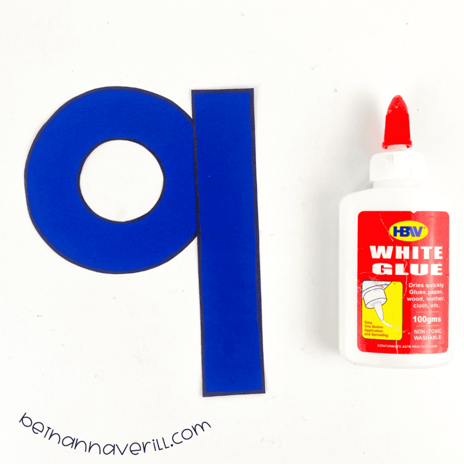 Blue pieces joined into a lowercase q