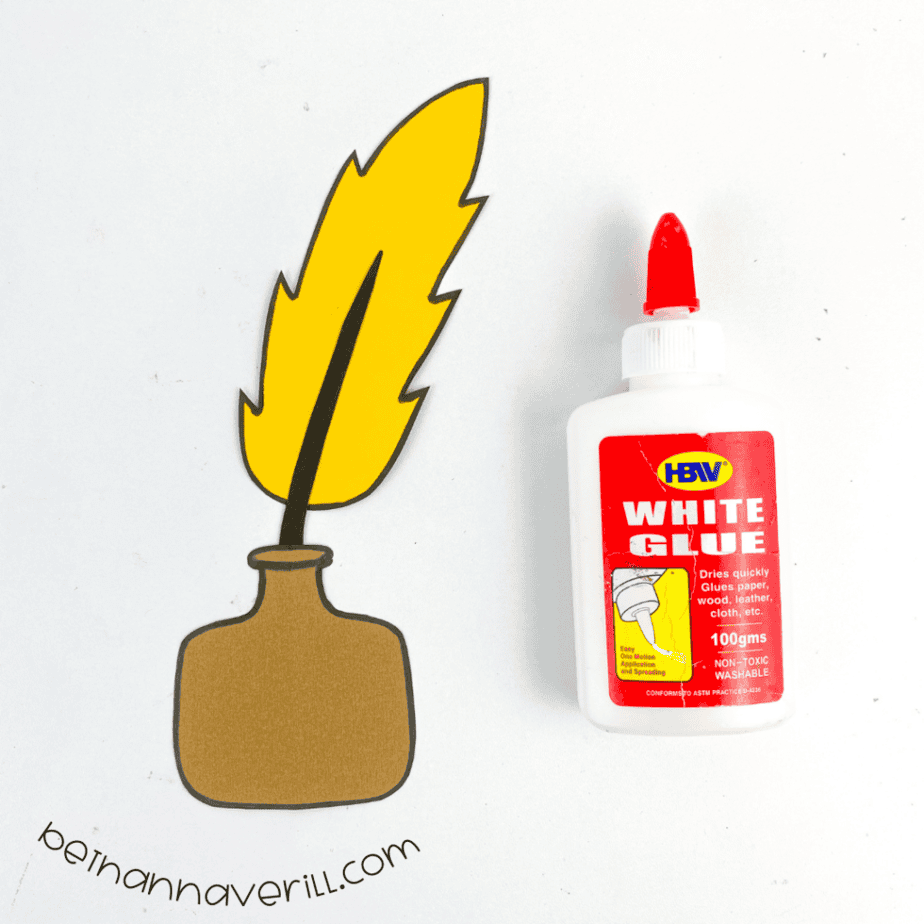 Feather quill glued into the paper ink container