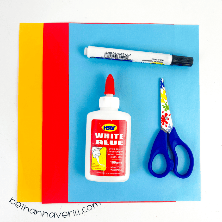Red, orange, yellow and blue construction paper, glue, a marker and scissors