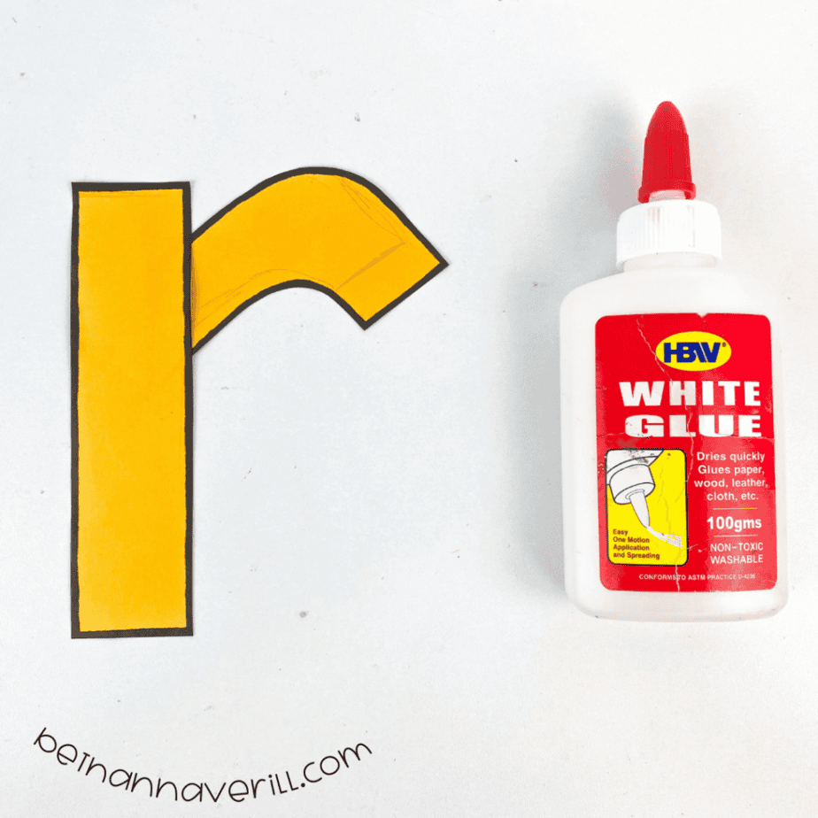 Orange paper pieces glued into a lowercase r