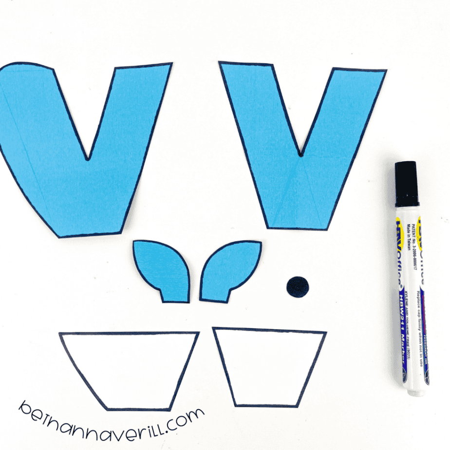Black marker outlines around the w is for Whale paper shapes