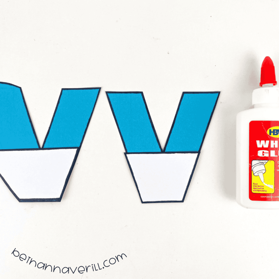 White trapezoids glued to the bottom of the blue v pieces