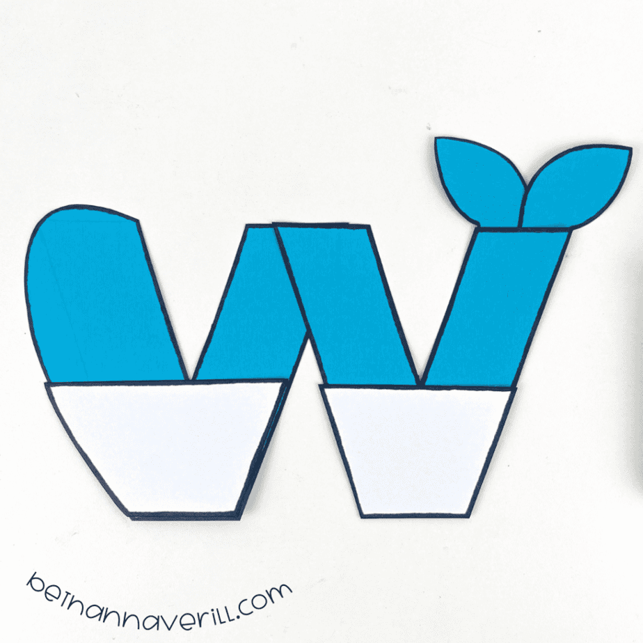 Two fin shapes glued together as a whale tail on the thinner v