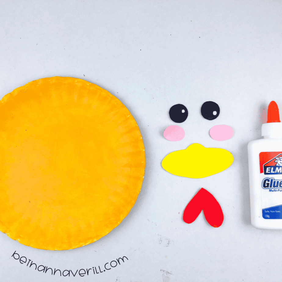 Yellow plate with the beak, wattle, eyes and cheeks ready to glue