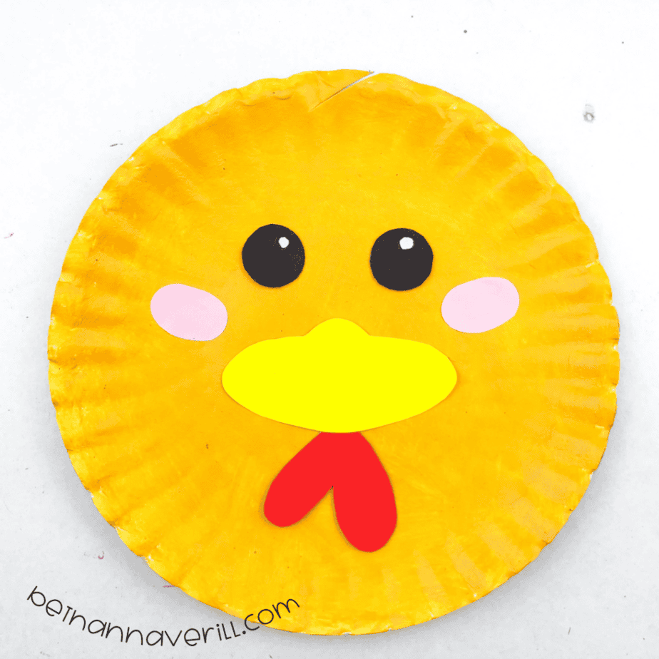 Yellow plate chicken face with eyes, beak, cheeks and a red wattle