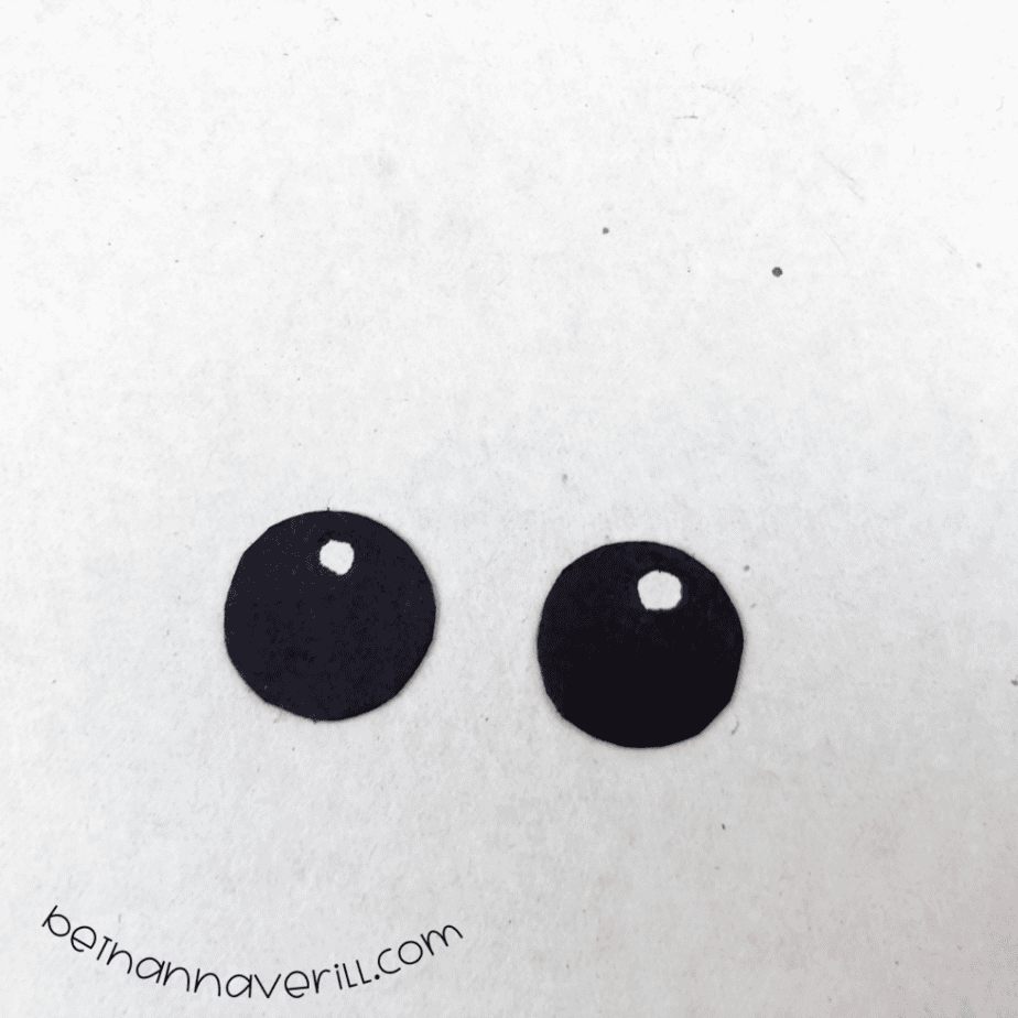 Two black eyes with white highlights