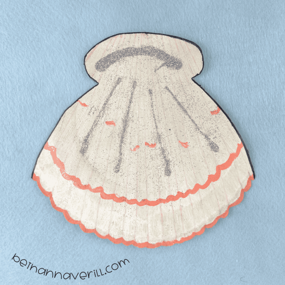 Finished paper plate clam shell craft with pink and silver glitter details