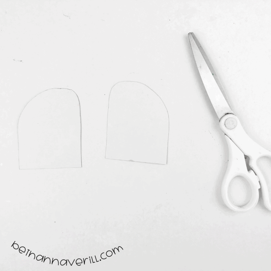 Two white arc shapes cut from the other half of the plate