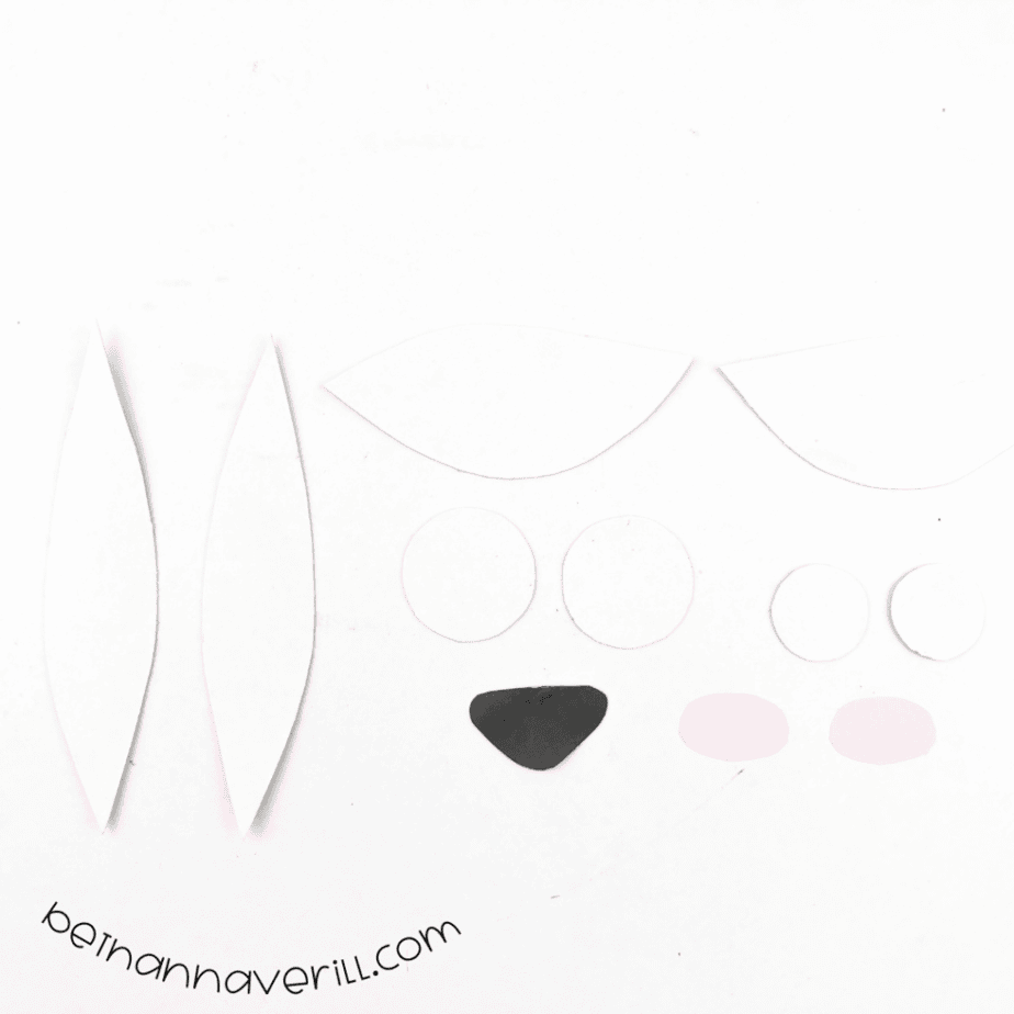 Goat ears, eyes, nose and cheeks traced and cut from paper