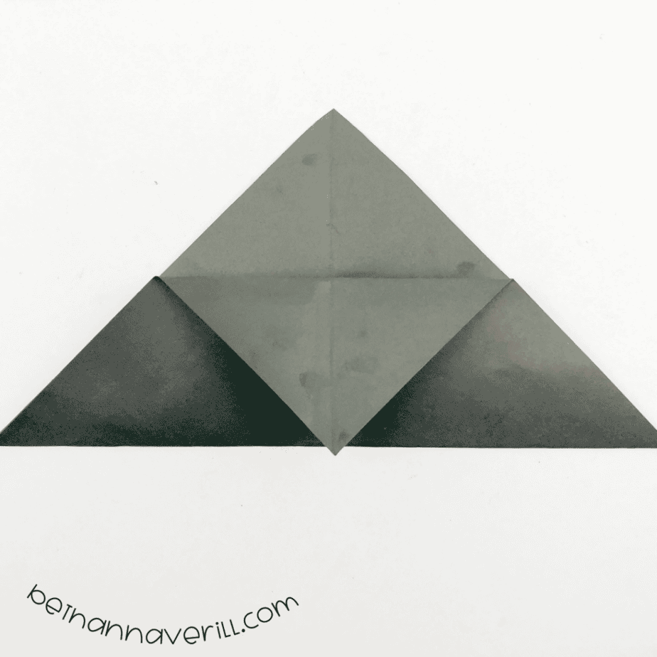 Black paper triangle with the front flap folded down