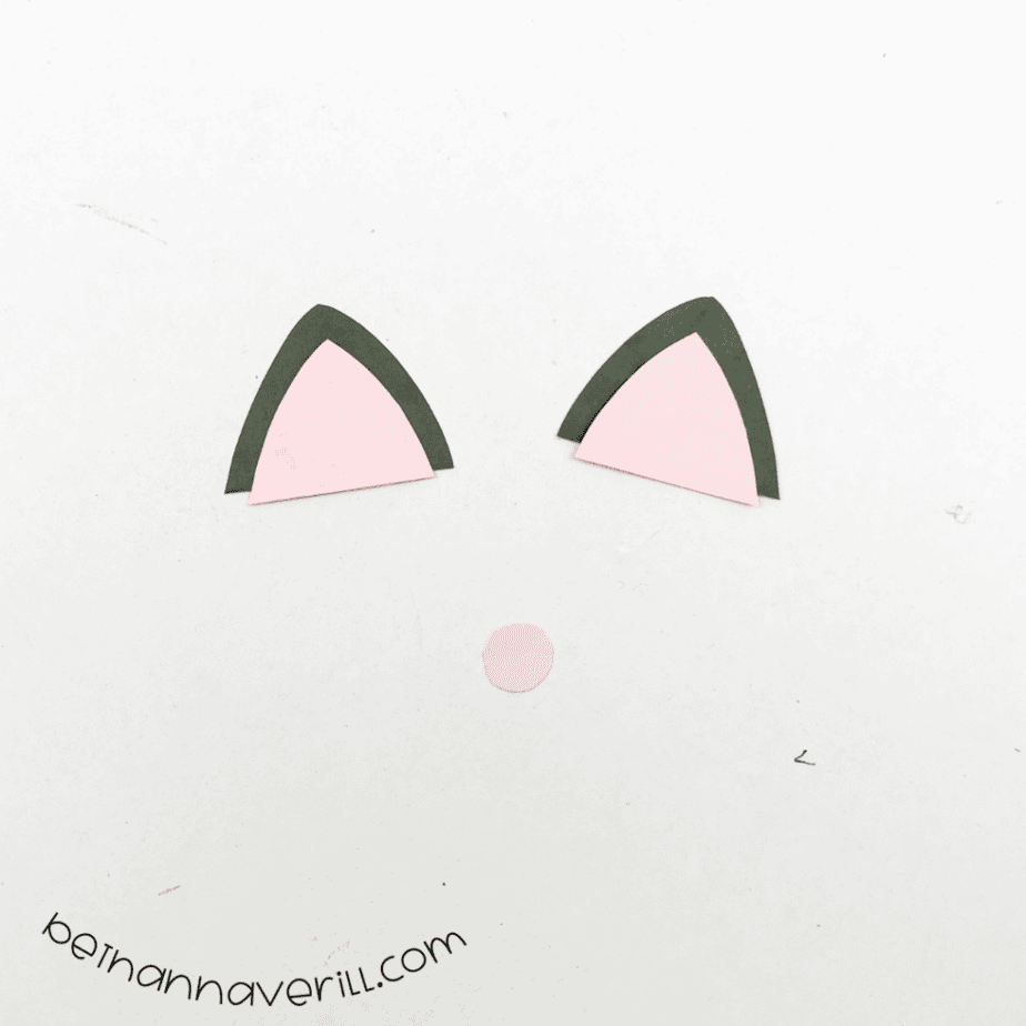 Pink inner ears glued onto black cat ears