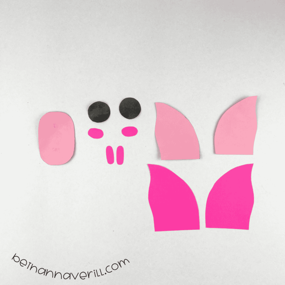 Pig eyes, nostrils, cheeks and ears cut from black and pink paper