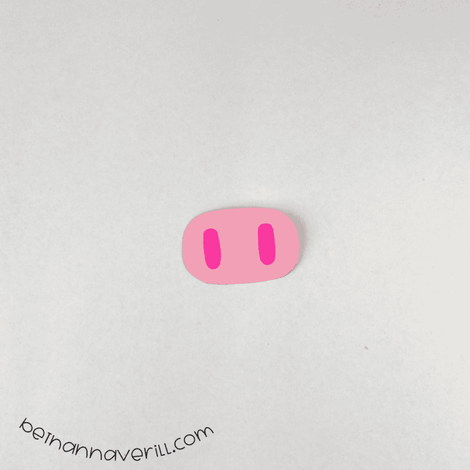 Pink paper pig snout with dark pink nostrils