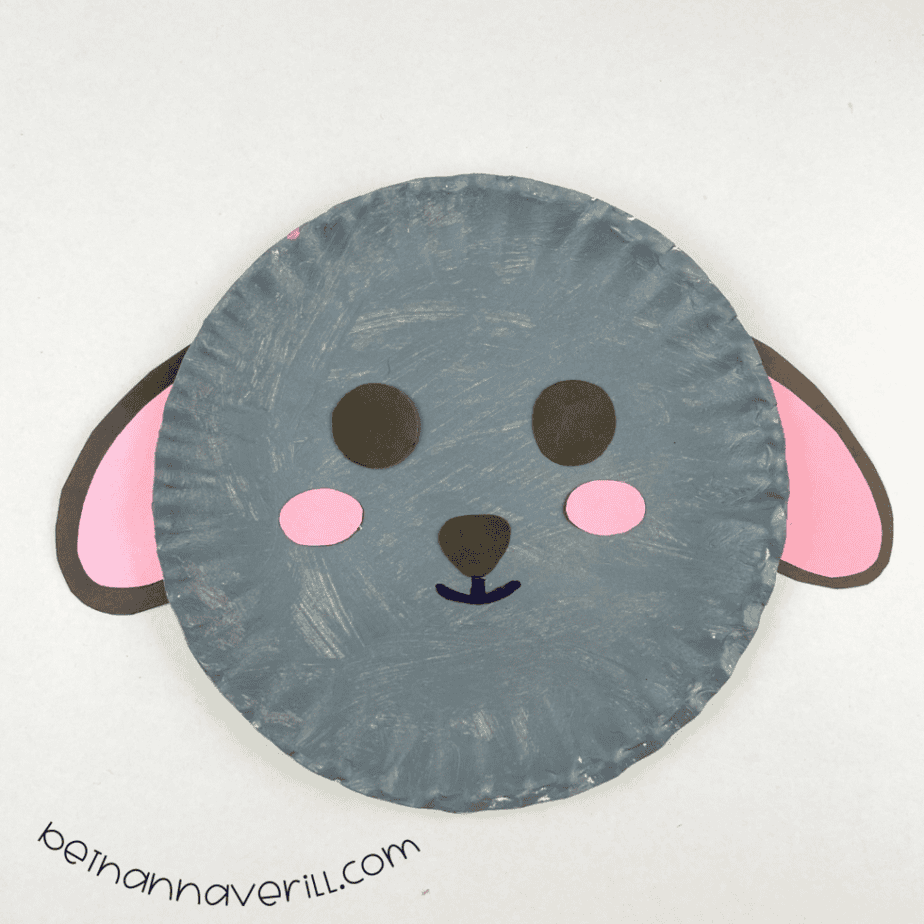 Pink-lined ears attached behind the gray sheep plate