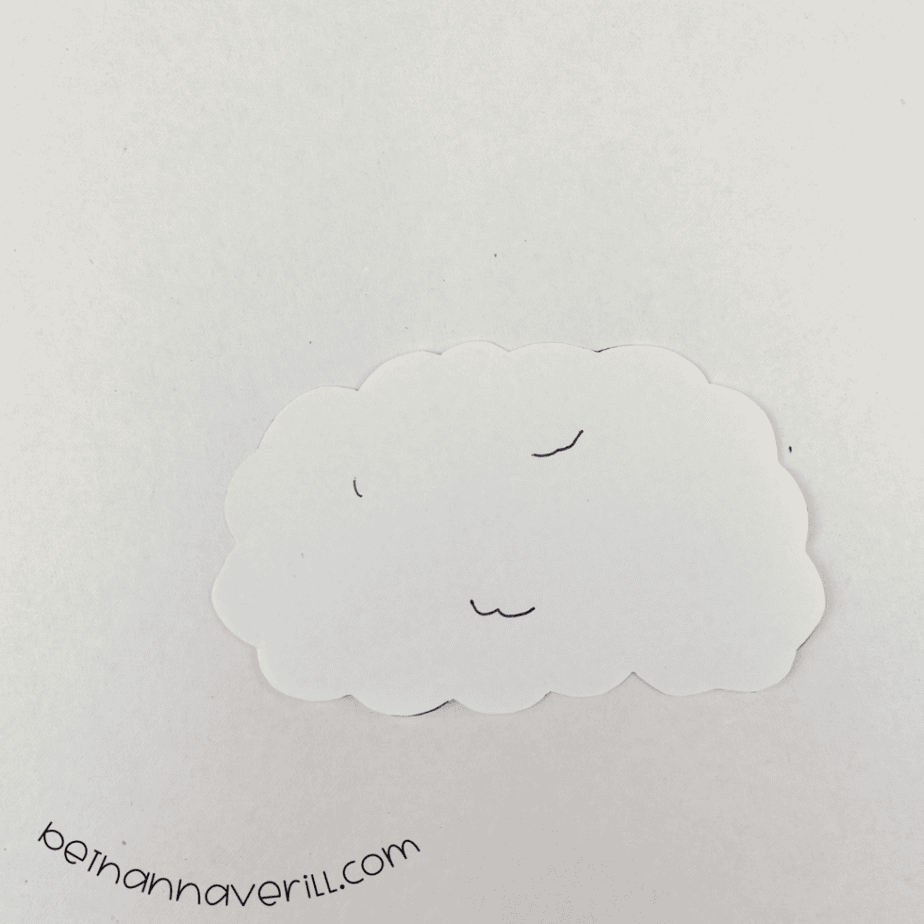 White cloud-shaped paper wool with drawn squiggles